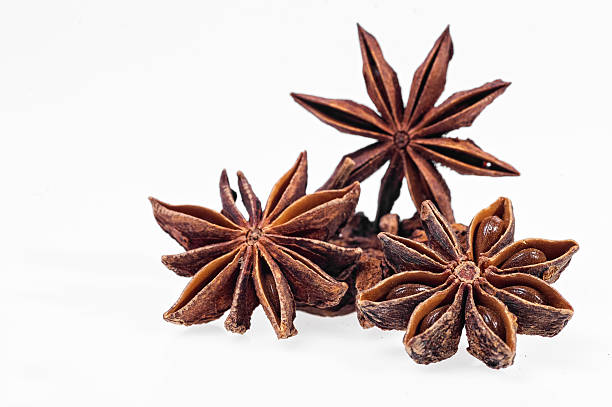 istock Cinnamon, anise and cloves on white background 471688738