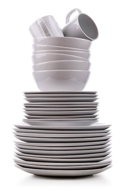 Stack of clean dishes on a white background Stack of white plates and dishes washing dishes stock pictures, royalty-free photos & images