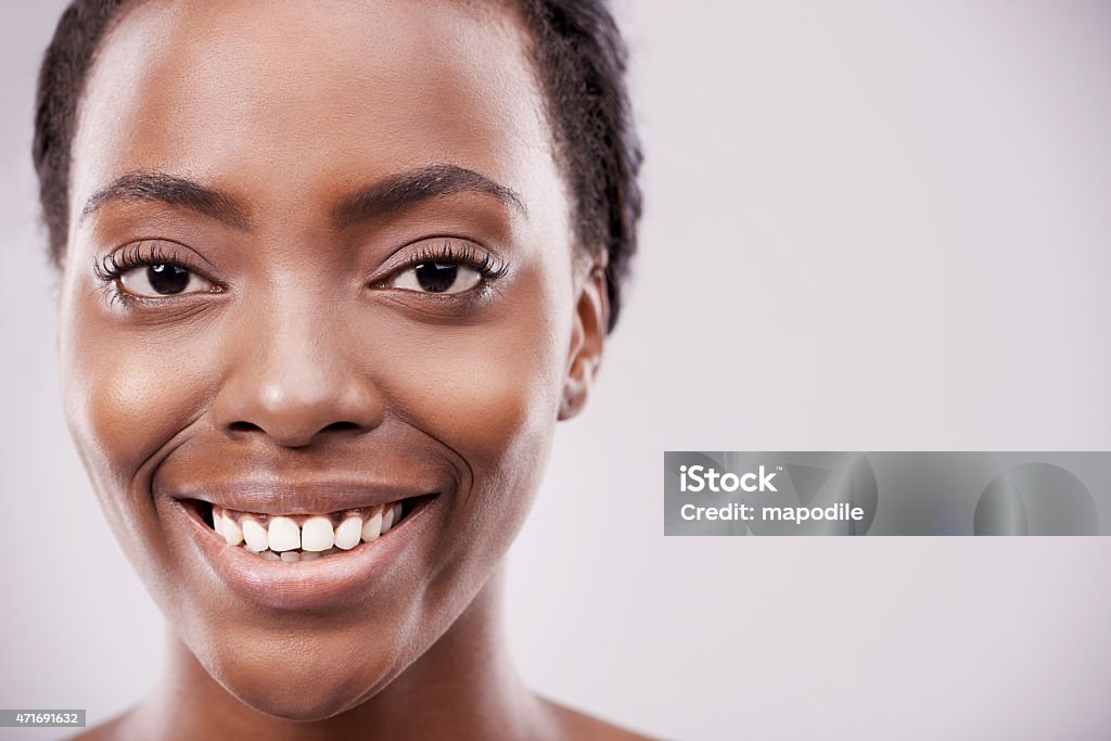 Radiant beauty Cropped portrait of a beautiful young woman against a gray backgroundhttp://195.154.178.81/DATA/i_collage/pu/shoots/785451.jpg 20-29 Years Stock Photo