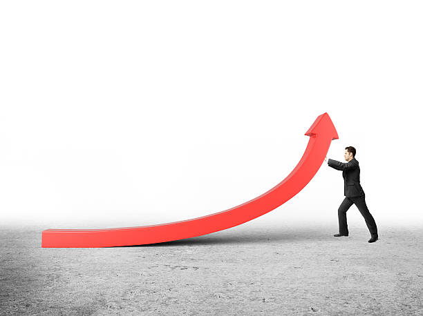 istock businessman raises arrow 471691643
