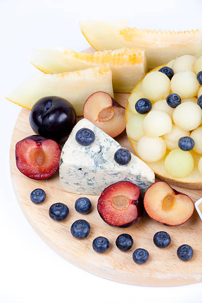 istock Various fruits on the plate. Melon, blueberries 471691939