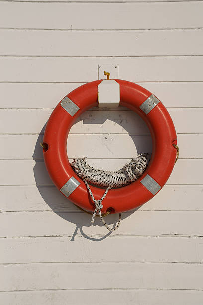 istock Life Buoy Hanging on a Wall 471691971