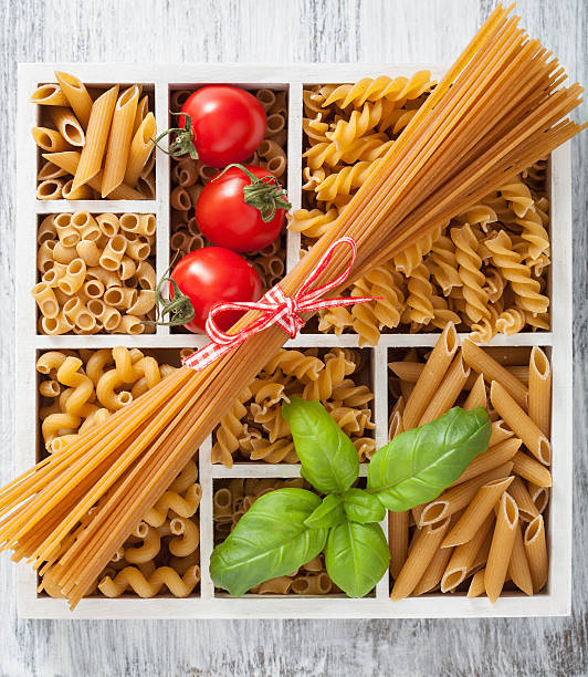 istock various raw wholegrain pasta in white wooden box 471692162