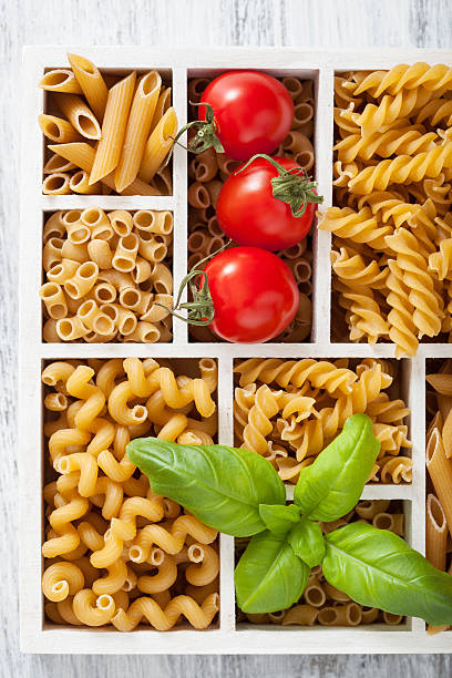istock various raw wholegrain pasta in white wooden box 471692174