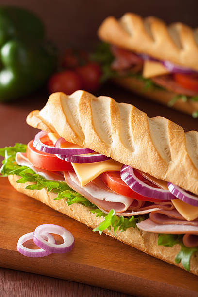 istock long baguette sandwich with ham cheese tomato lettuce 471692296
