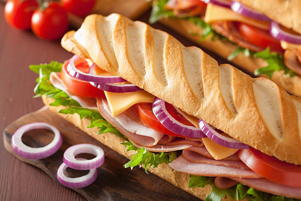istock long baguette sandwich with ham cheese tomato lettuce 471692298