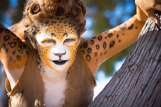 Woman in elaborate jungle cat stage makeup and costume Woman in elaborate jungle cat stage makeup and costume. cat face paint stock pictures, royalty-free photos & images