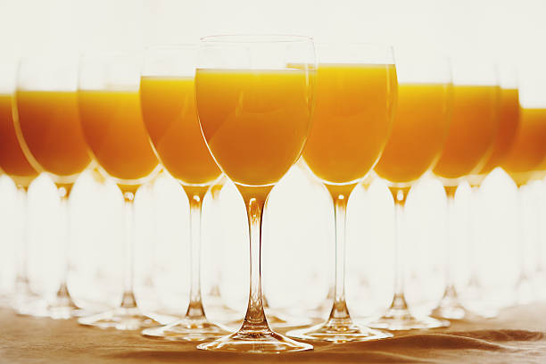istock Row of Glasses with Fresh Orange Juice 471692624