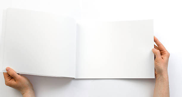 istock Opening a blank magazine in front of a white background 471692950