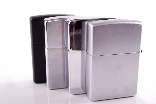 Silver metal zippo lighters on white