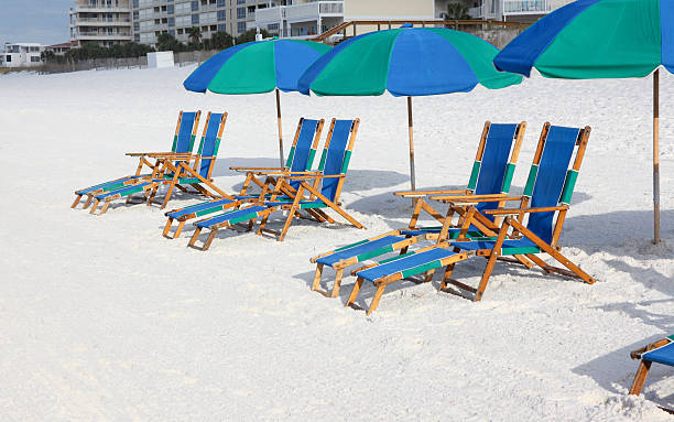 istock Beach Lounge Chairs and Umbrellas 471693120