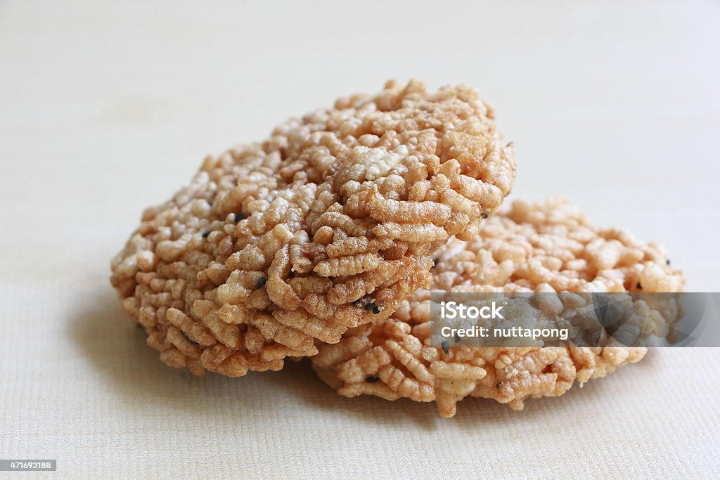 Khaotan, rice cracker. Khaotan, rice cracker. North thailand Food on Wood Background 2015 Stock Photo