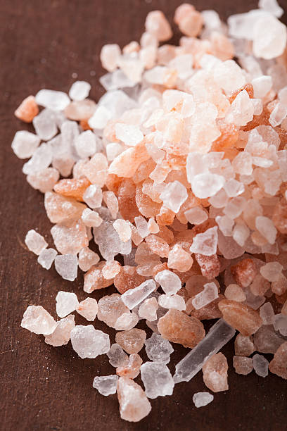 istock pink himalayan salt over wooden background 471693208