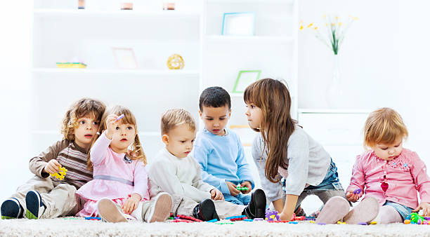 istock Kids playing in the living room. 471694045