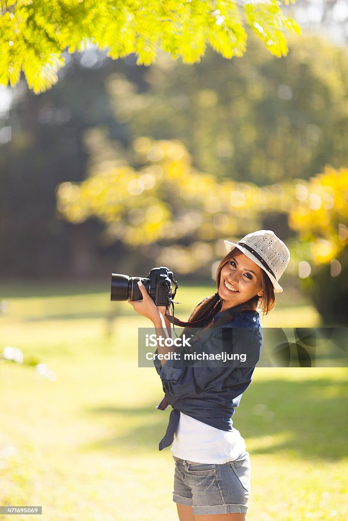 young photography student take photos outdoors cheerful young photography student take photos outdoors at the park Adult Stock Photo