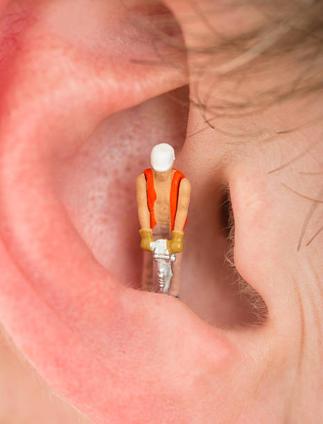 istock tinnitus ear with costruction worker macro shot 471695086