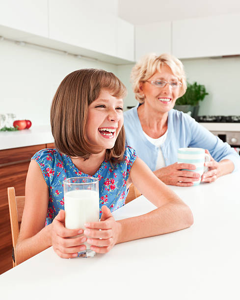 istock Cute girl with milk 471695185