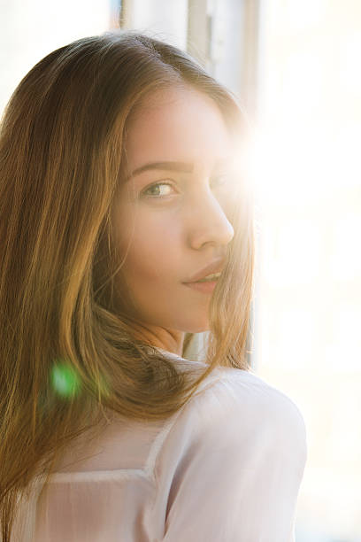 istock woman in light flare 471695374