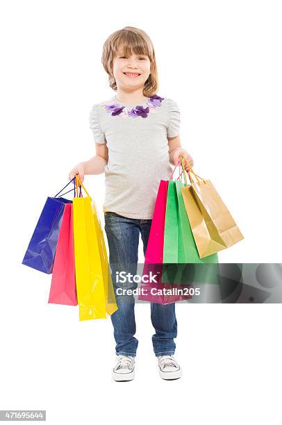 Young Blonde Girl Holding Shopping Bags Stock Photo - Download Image Now - 2015, Bag, Beautiful People