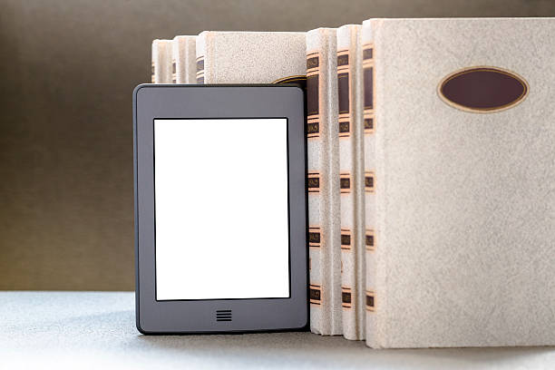 Ebook and old books on table stock photo