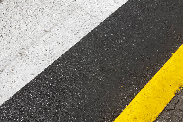 istock Street lines on pavement, black, white and yellow 471698521