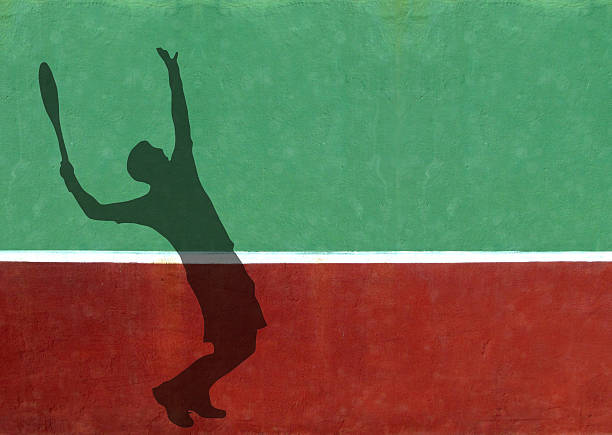 istock Tennis Player Serving Silhouette Against Practice Wall 471698657