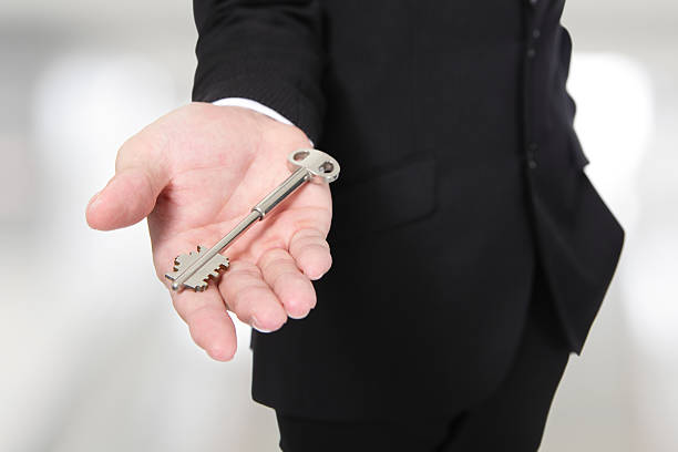 istock businessman holding keys 471700463