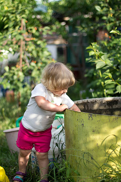 istock Little girl having fun on swing 471700503