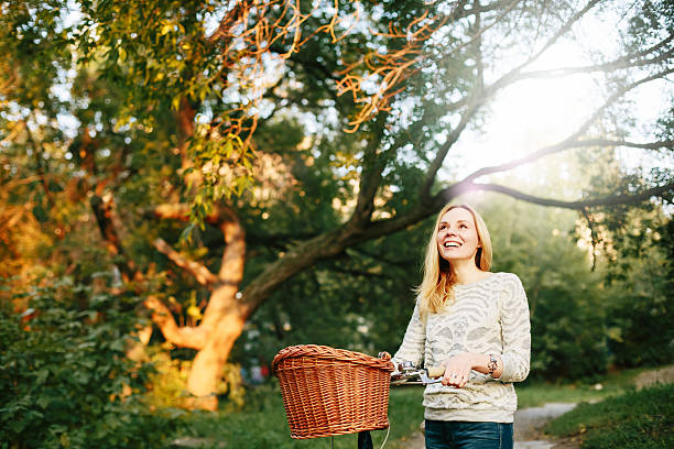 istock Young blonde woman on a vintage bicycle 471701008