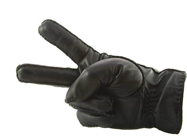 istock Leather glove showing victory isolated over white 471701567