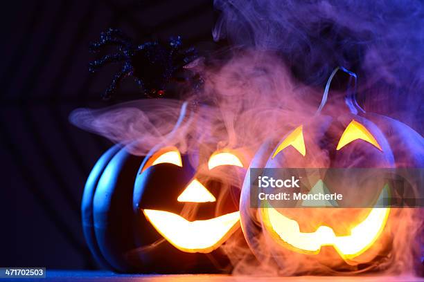 Halloween Pumpkin In Dark Blue With Spider Web And Smoke Stock Photo - Download Image Now