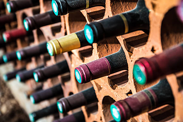 Wine bootles from cellar in selective focus stock photo