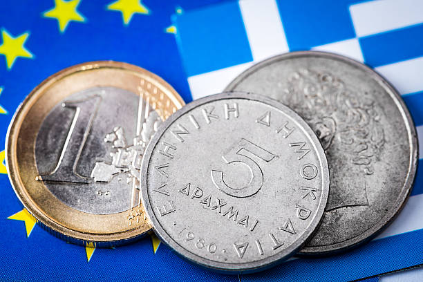 istock Euro and Drachma coins on Greek and EU flags 471702532