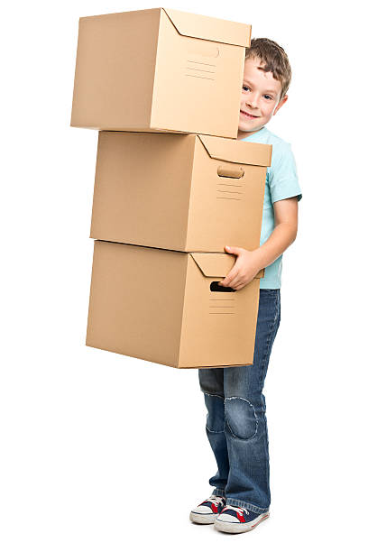 istock portrait of small boy with boxes 471705167