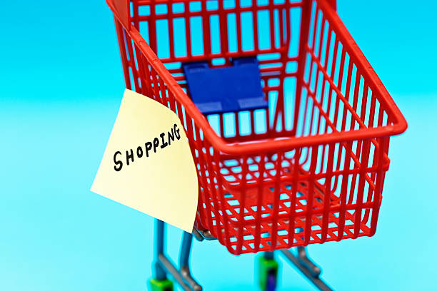 istock Label on tiny supermarket trolley says SHOPPING: go for it! 471705535