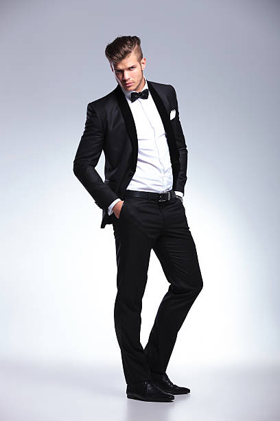 istock business man posing with hands in pockets 471705735