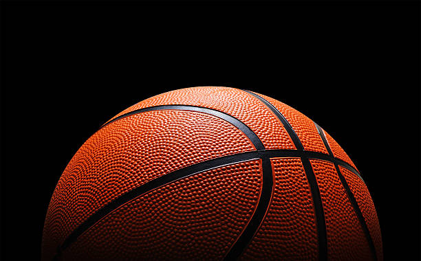 Basketball Basketball against black slam dunk stock pictures, royalty-free photos & images