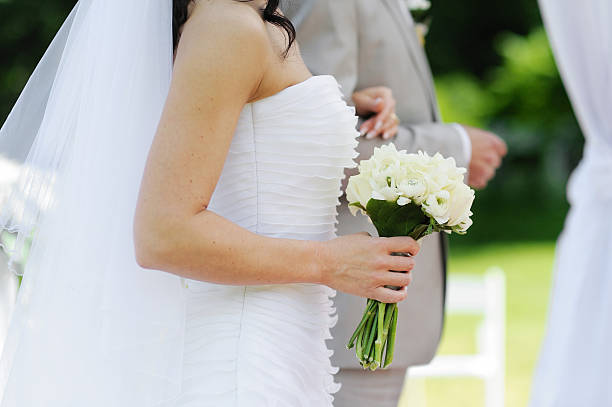 istock Bride holding beautiful wedding bouquet 471707693