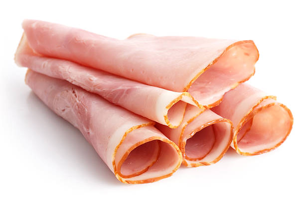 istock Premium slices of ham arranged on white. 471708444