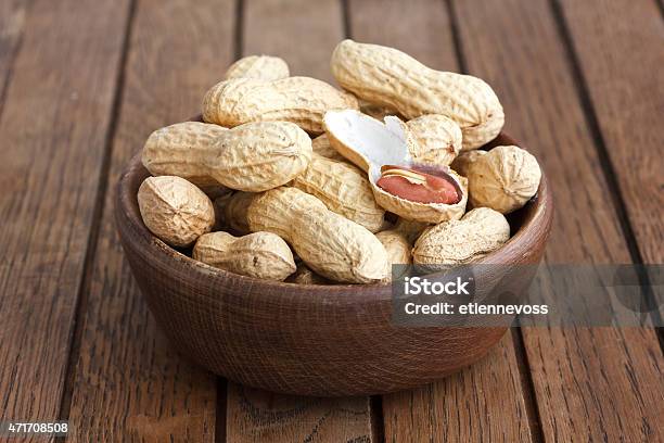 Rustic Wood Bowl Of Peanuts In Shells Stock Photo - Download Image Now - 2015, Atmosphere, Backgrounds