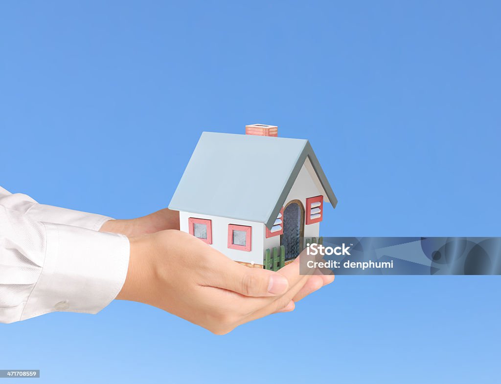 Protect Your House in hand businessmen Protect Your House in hand Adult Stock Photo