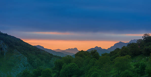 Aerial view of picturesque rocky landscape of National Park in Picos de Europa mountain range at sunset, Asturias, Spain