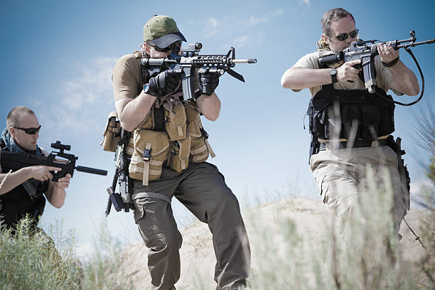 istock Military soldiers doing training exercises in desert 471708857
