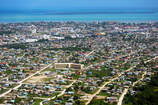 Flying into Belize City, Belize with Caribbean view in the background.