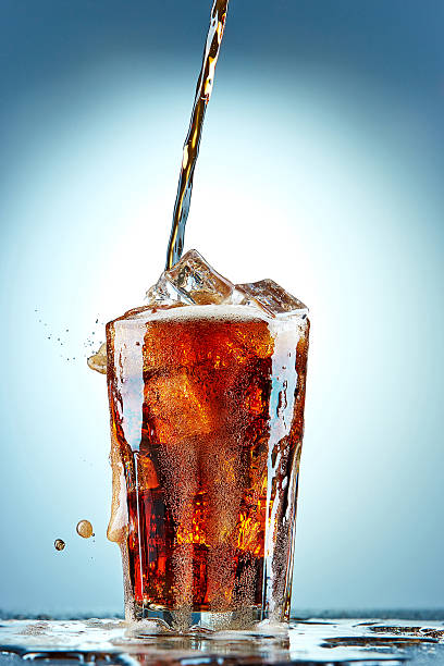 istock Cola pouring in a glass 471709156
