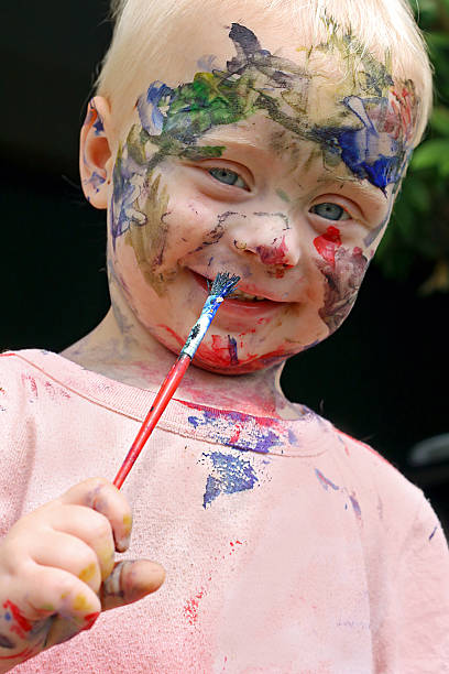 istock Baby Painting His Face 471709313