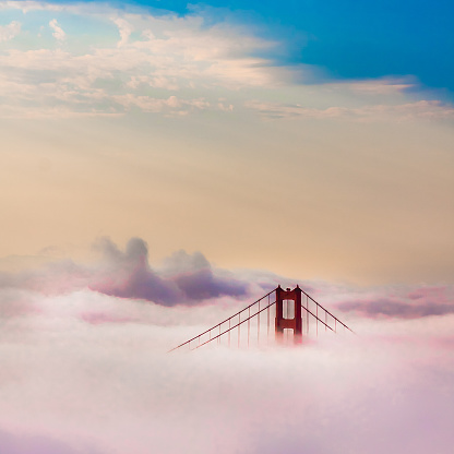 Golden Gate Bridge above Clouds after sunrise in San Francisco