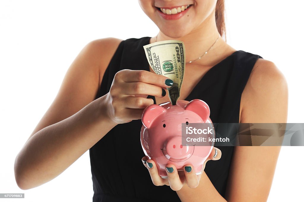 Saving for the Future Saving for the Future with Piggy Bank and US Currency Singapore Stock Photo