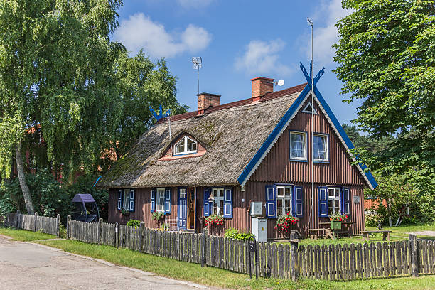 istock Traditional wooden house on Curonian Spit 471710641