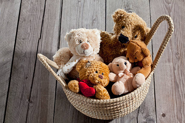 istock Teddy-bears in basket on wood 471711004